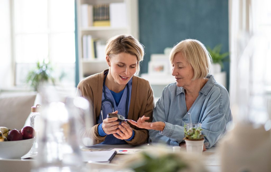 Doctor consulting with elderly patient.